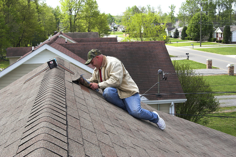 professional roofer during work 